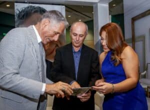 The personal touch at his booth going over photos of his interiors featured in the PPG brochure